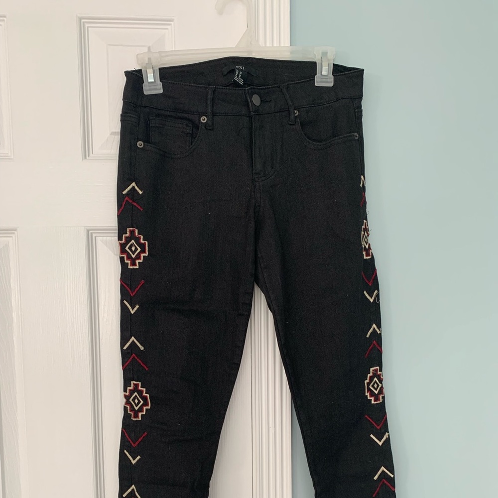 Forever XXI black jeans with embroidering down the leg, zippers at end of legs